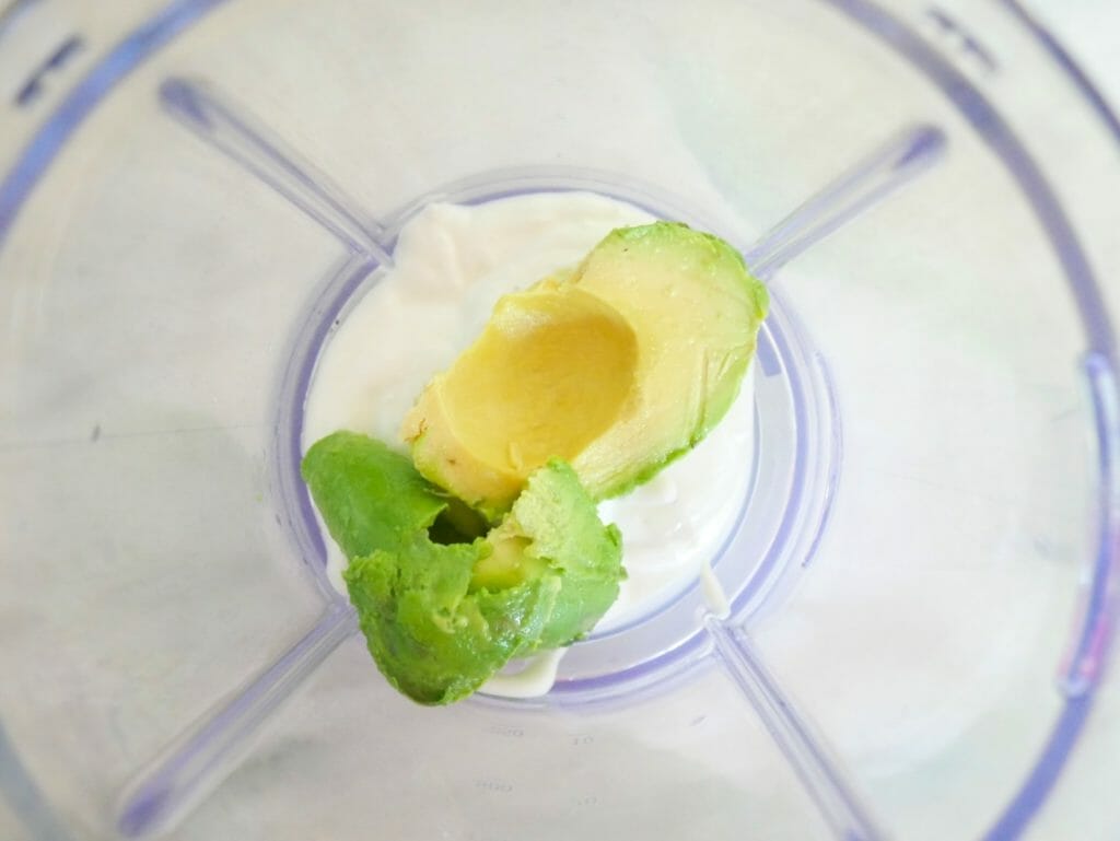 Coconut yogurt and avocado in a blender