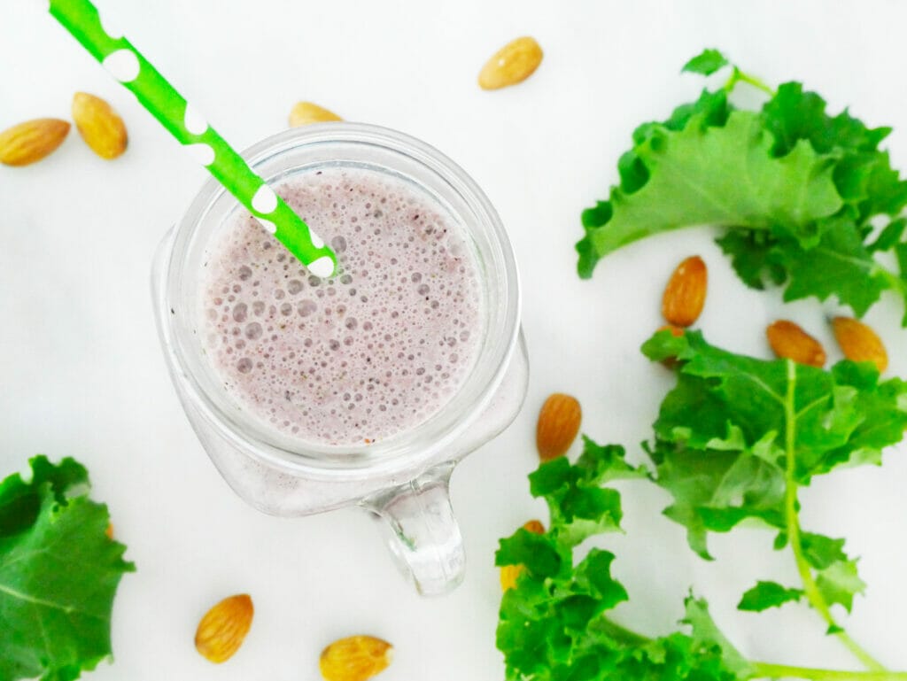 Kale weight loss smoothie from above with green straw