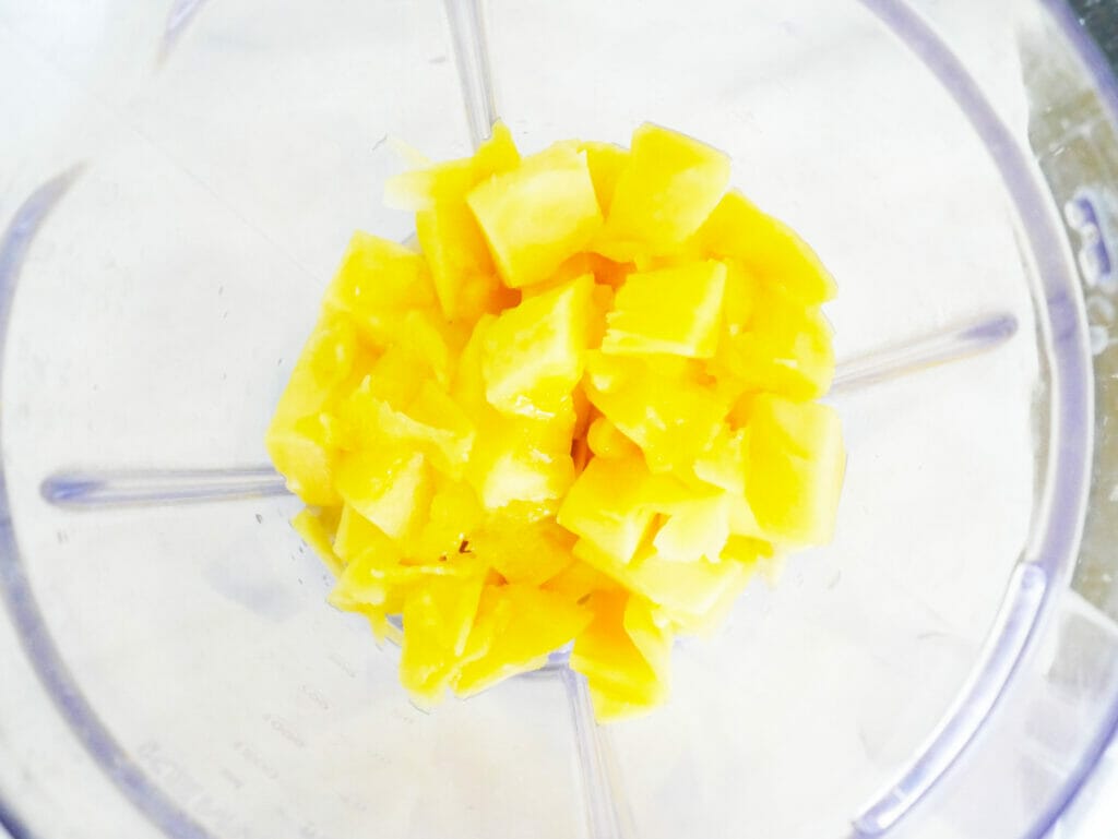 Mango and pineapple in a blender