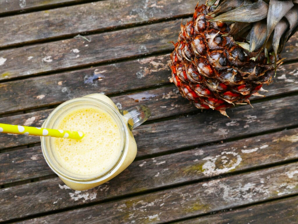 Mango coconut smoothie on a rustic table