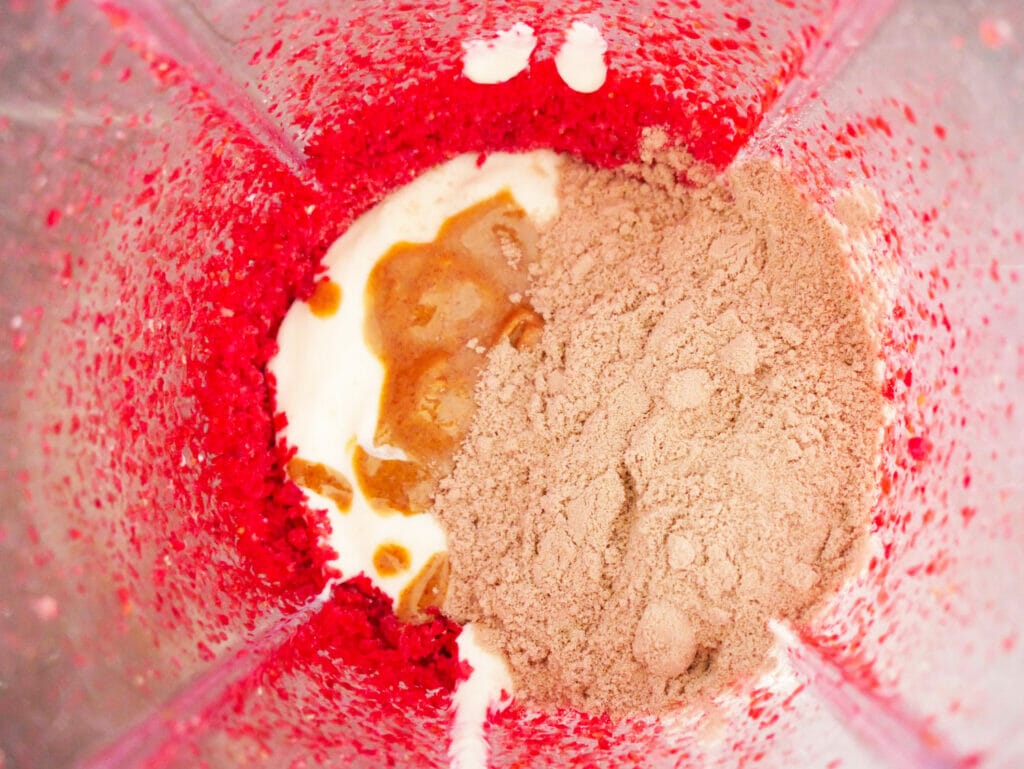 Keto chocolate protein shake ingredients in blender